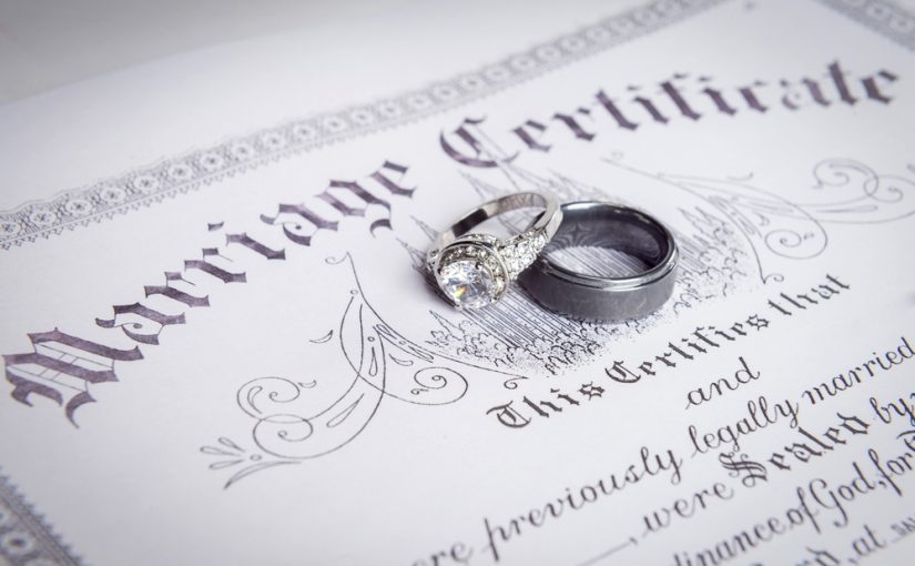 Translated marriage certificate with ring on it