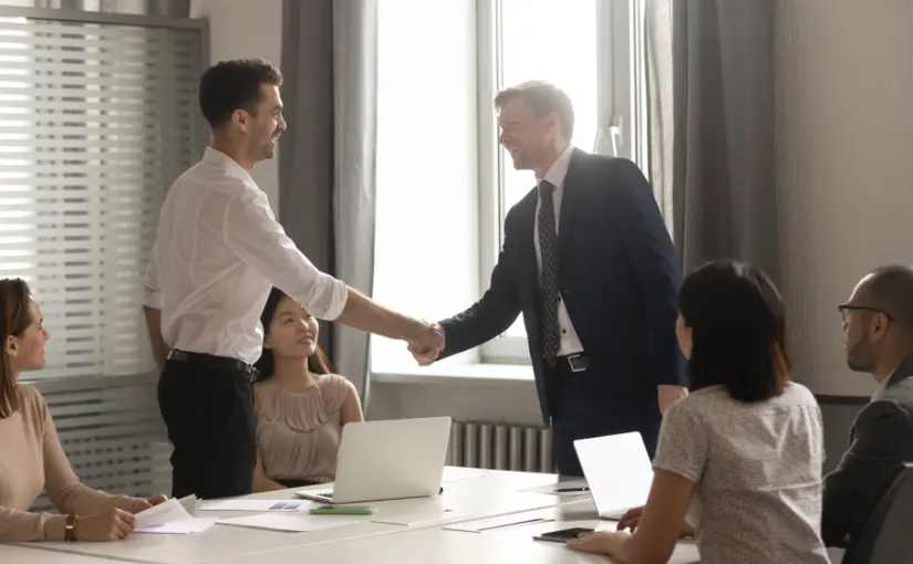Interpreters sitting in a business meeting